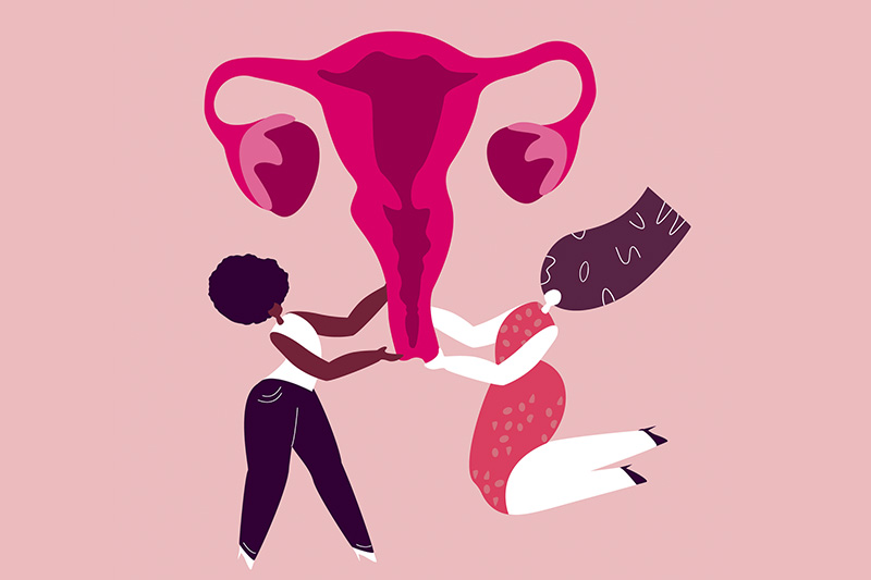 Ilustração de duas mulheres, uma de pele negra e outra branca, segurando útero, em artigo sobre corrimento vaginal 