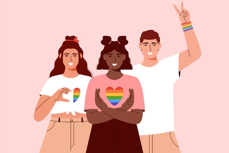 Ilustração de jovens, duas mulheres e um homem, com acessórios com as cores da bandeira LGBTQIAPN celebrando o mês do orgulho